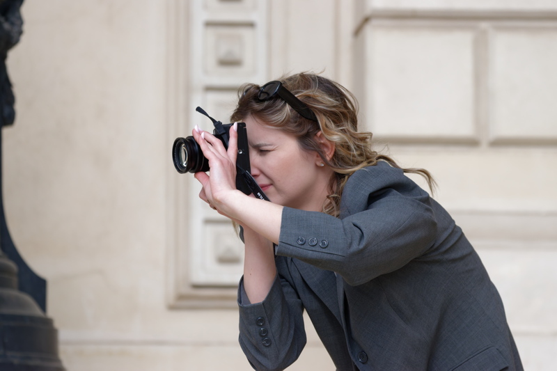 Woman photographing with a digital camera